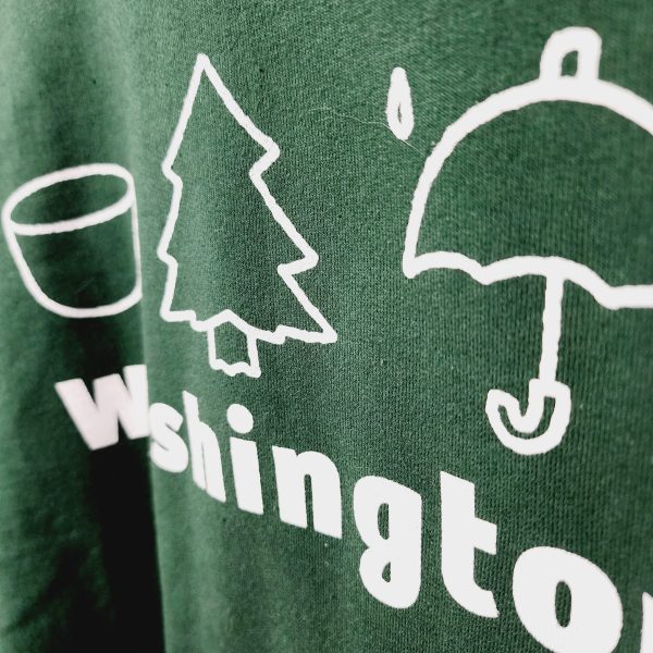 Short sleeve green Tee with symbolic icons of WA state.